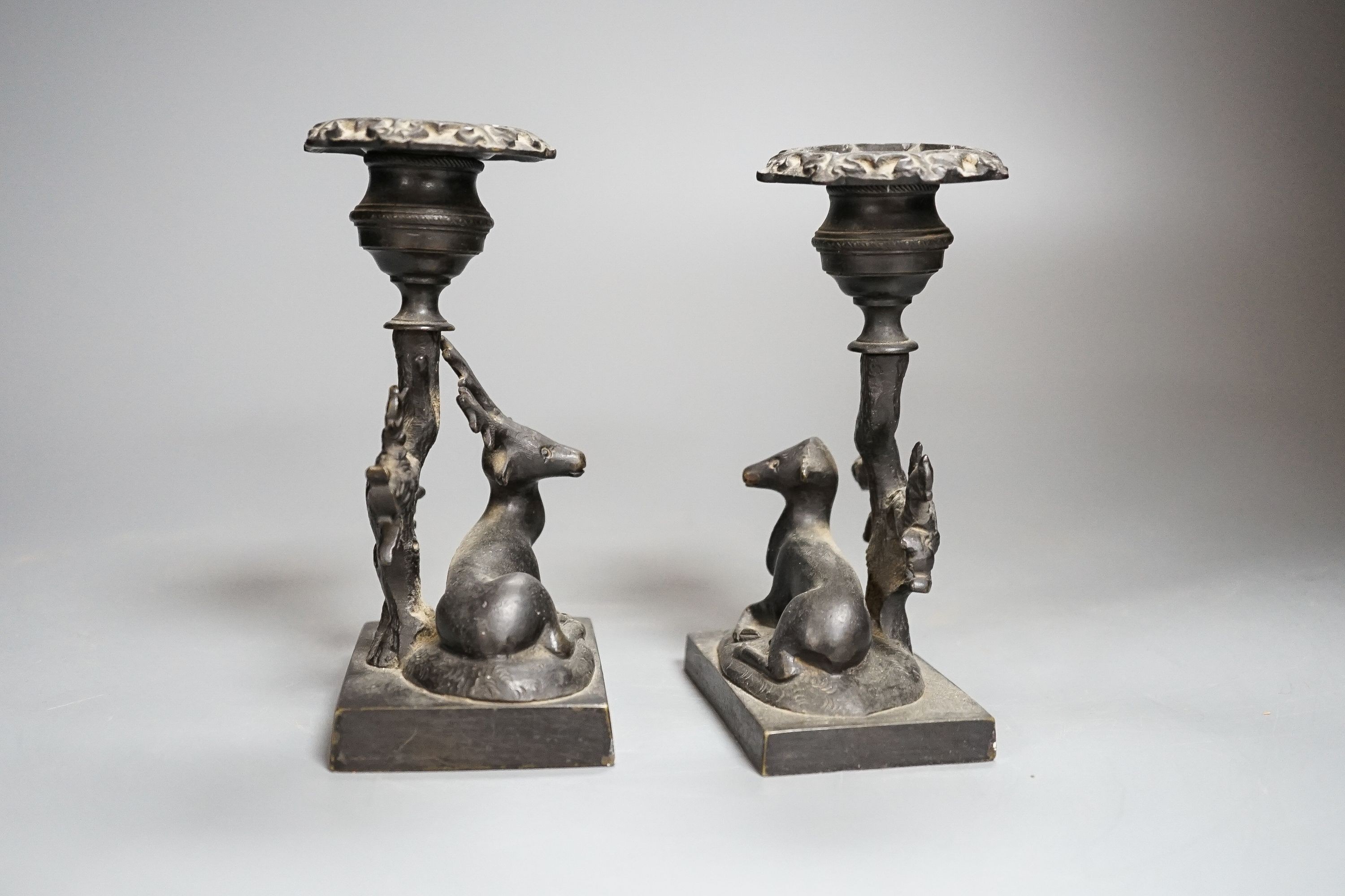 A pair of 19th century bronze ‘stag and doe’ dwarf candlesticks 14cm